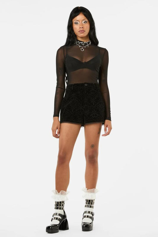 Image of a model wearing Shorts. Productname: Not Afraid Velvet Shorts in Black colour by brand - Black Friday