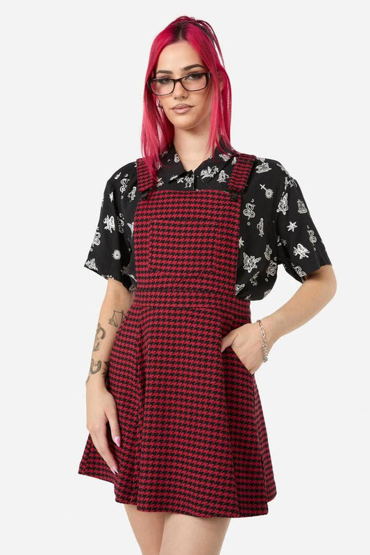 Image of a model wearing Dress. Productname: Virtue Houndstooth Pinny in Red/Black colour by brand - Black Friday