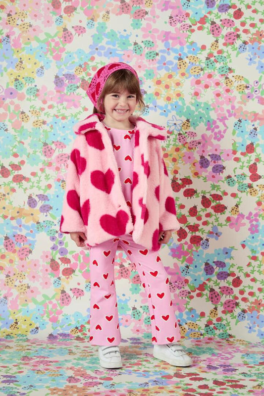 Image of a model wearing Outerwear. Productname: Hearts Kids Faux Fur Jacket in Pink colour by brand - Princess Highway Kids