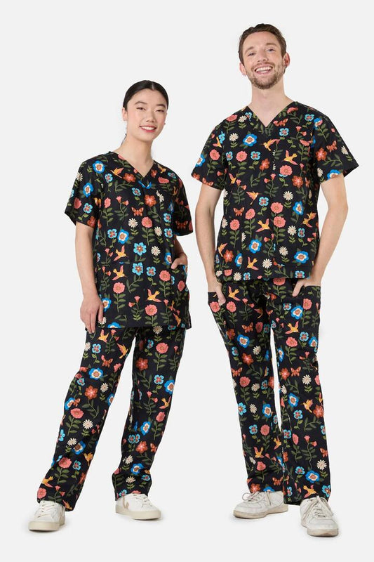 Image of a model wearing Uniforms & Workwear. Productname: Hummingbird Scrub Set in Navy colour by brand - Scrubs With Love