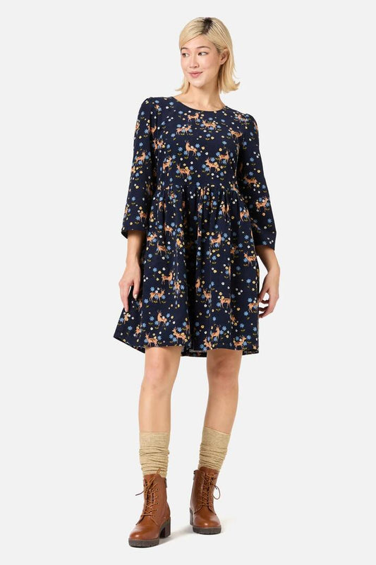 Image of a model wearing Dress. Productname: Meadow Deer Cord Sleeved Dress in Navy colour by brand - Princess Highway