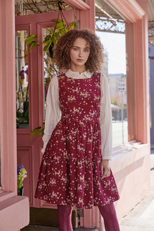 Image of a model wearing Dress. Productname: Meadow Deer Cord Tiered Dress in Red colour by brand - Princess Highway