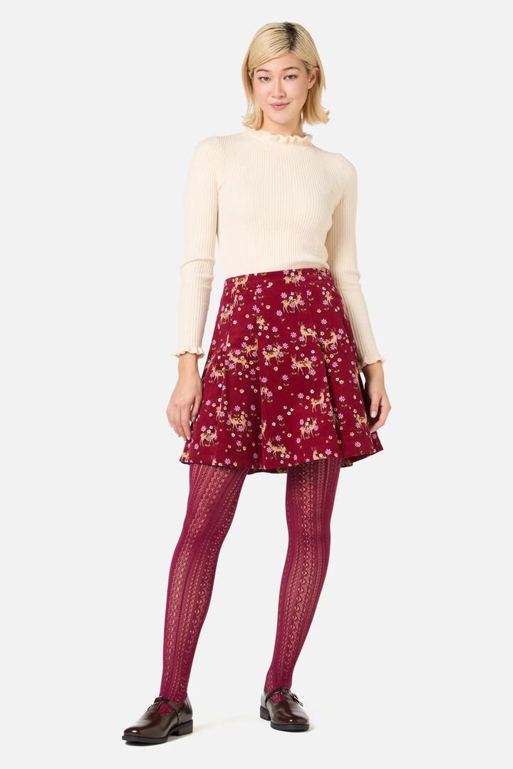 Image of a model wearing Skirts. Productname: Meadow Deer Cord Mini Skirt in Red colour by brand - Princess Highway