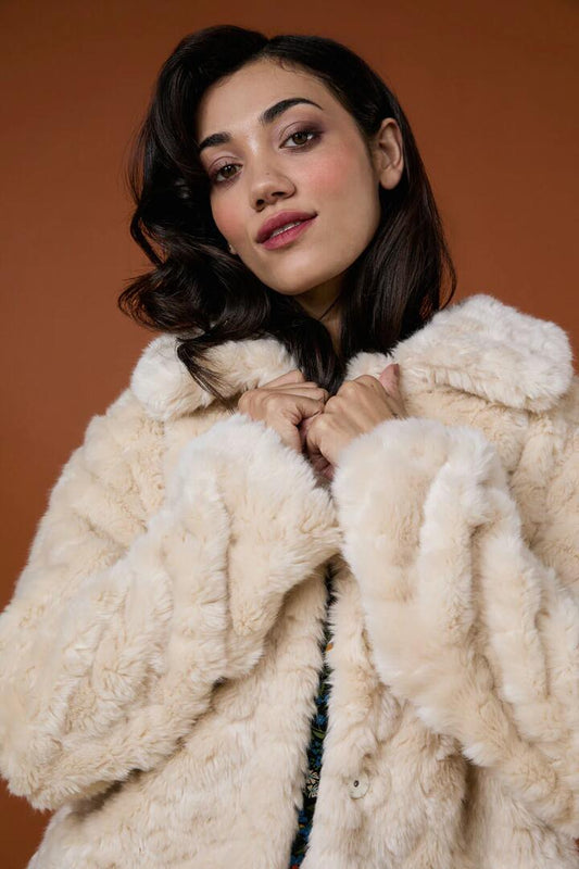 Image of a model wearing Outerwear. Productname: Penelope Faux Fur Jacket in Cream colour by brand - Princess Highway