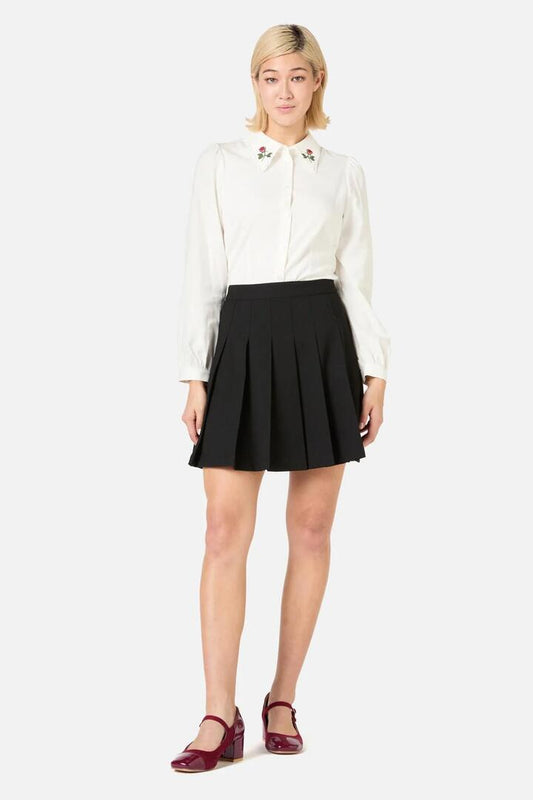 Image of a model wearing Skirts. Productname: Briony Pleated Mini Skirt in Black colour by brand - Princess Highway