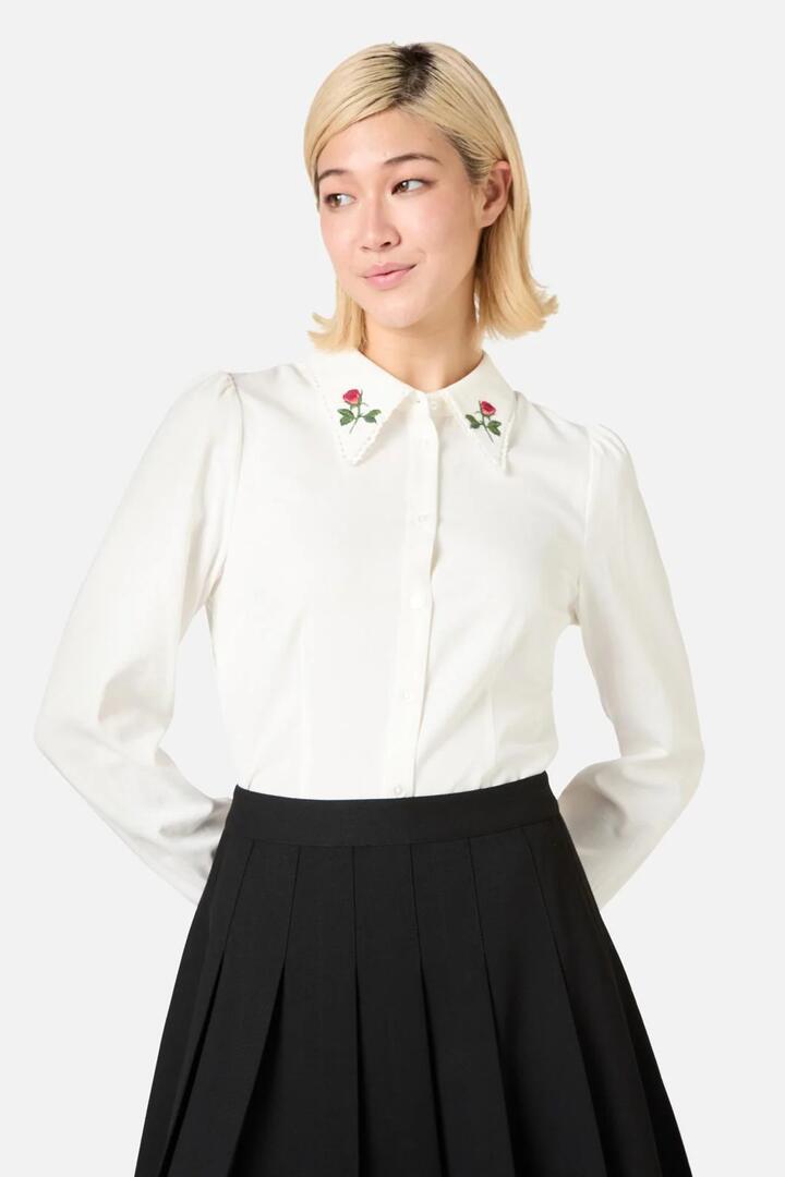 Image of a model wearing Tops. Productname: Rose Bud Embroidered Blouse in Cream colour by brand - Princess Highway