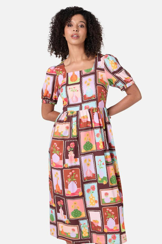 Image of a model wearing Dress. Productname: Flower Vases Midi Dress in Rust colour by brand - Princess Highway