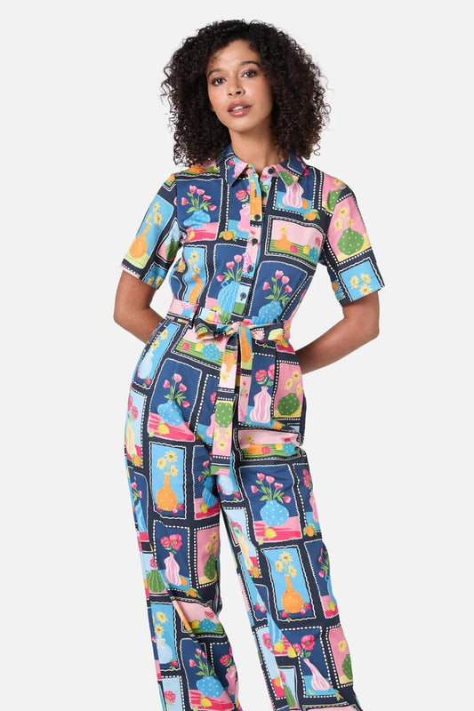 Image of a model wearing Outerwear. Productname: Flower Vases Jumpsuit in Navy colour by brand - Princess Highway