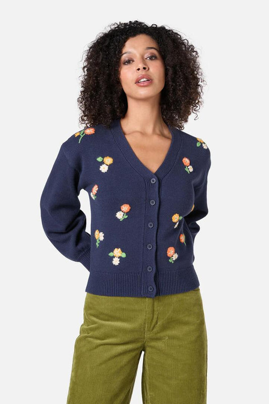 Image of a model wearing Outerwear. Productname: Blossom Embroidered Cardigan in Navy colour by brand - Princess Highway