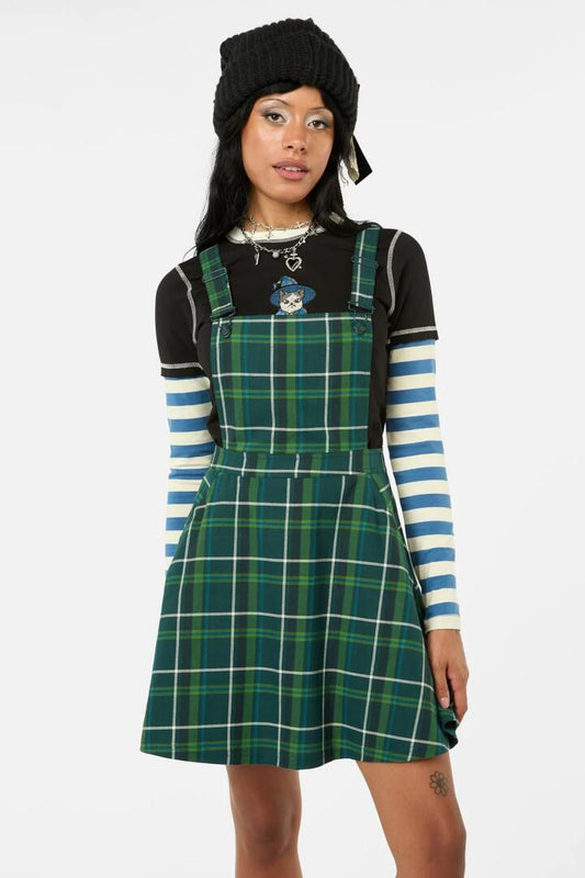 Image of a model wearing Dress. Productname: Jester Tartan Bib N Brace Pinafore in Green colour by brand - Black Friday