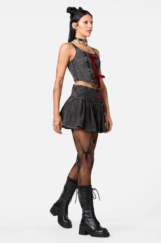 Image of a model wearing Denim. Productname: Moggy Denim Pleated Skort in Black colour by brand - Dangerfield