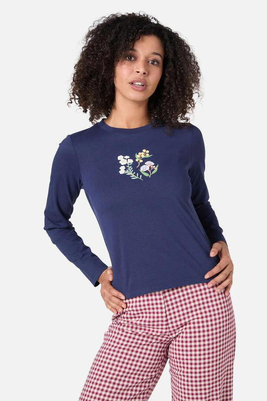 Image of a model wearing Tops. Productname: Elsie Flower Long Sleeve Tee in Navy colour by brand - Princess Highway