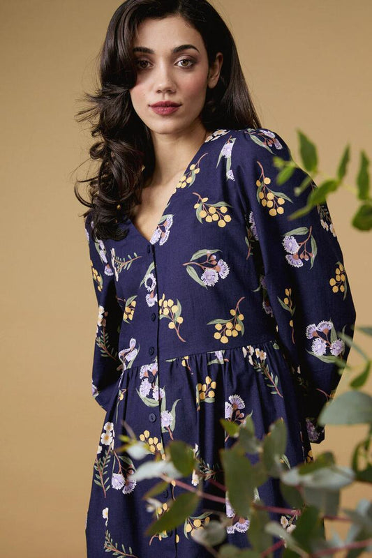 Image of a model wearing Dress. Productname: Elsie Native LS Smock Dress in Navy colour by brand - Princess Highway
