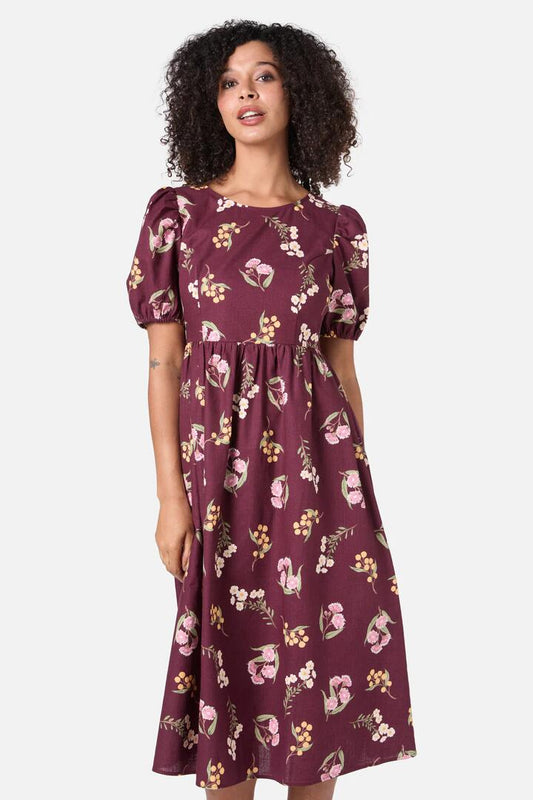 Image of a model wearing Dress. Productname: Elsie Native Midi Dress in Chocolate colour by brand - Princess Highway
