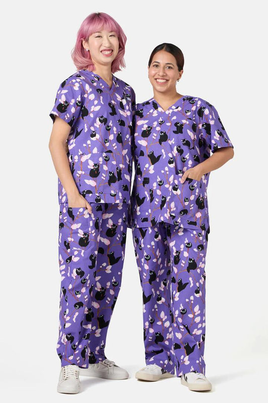 Image of a model wearing Uniforms & Workwear. Productname: Pussy Willow Scrub Set in Lavender colour by brand - Dangerfield