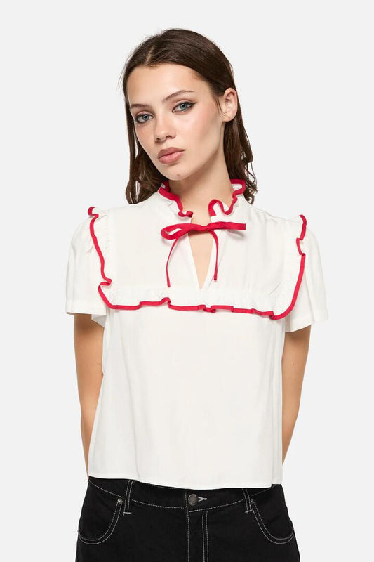 Image of a model wearing Tops. Productname: Little Bitter Frilly Blouse in Cream colour by brand - Dangerfield