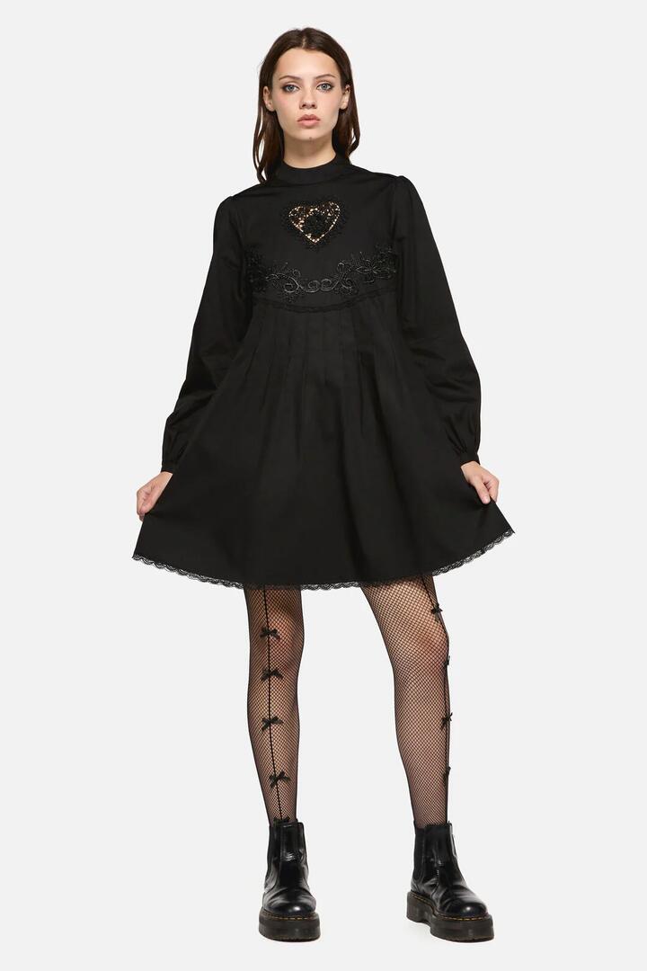 Image of a model wearing Dress. Productname: Little Bitter Baby Doll Dress in Black colour by brand - Dangerfield