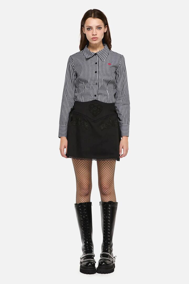 Image of a model wearing Skirts. Productname: Little Bitter Lacey Mini Skirt in Black colour by brand - Dangerfield