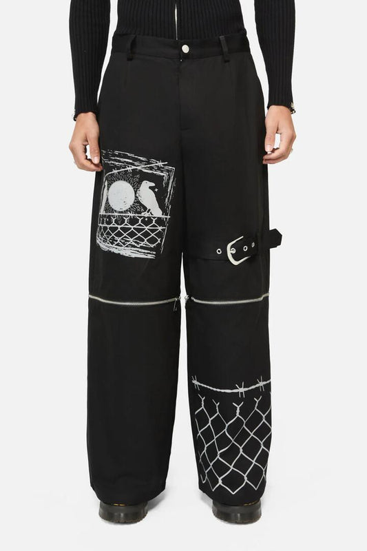Image of a model wearing Pants. Productname: Murder Of Crows Zip Off Pant in Black colour by brand - Black Friday