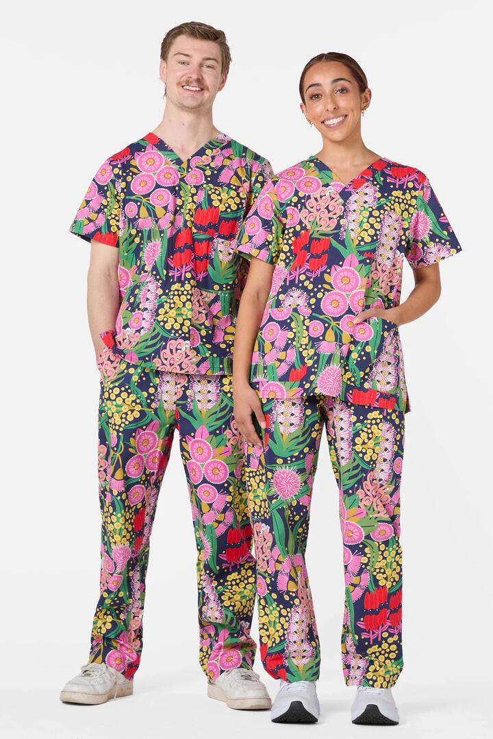 Image of a model wearing Uniforms & Workwear. Productname: Native Delight Scrub Set in Navy colour by brand - Scrubs With Love