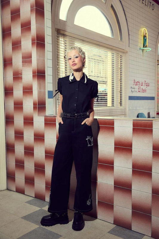 Image of a model wearing Tops. Productname: Catkins Collar Blouse in Black colour by brand - Dangerfield