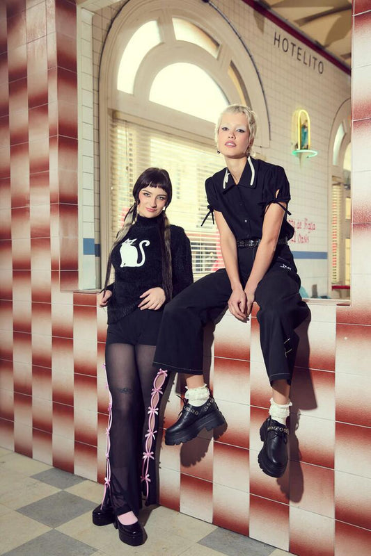 Image of a model wearing Outerwear. Productname: Catkins Boucle Knit Jumper in Black colour by brand - Dangerfield