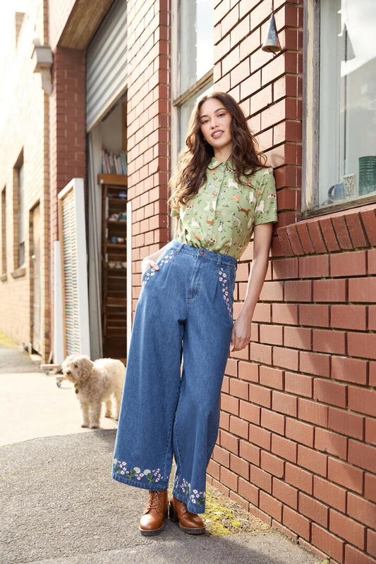 Image of a model wearing Pants. Product name - Dandelions Embroidered Denim Culotte in Mid Denim colour by brand - Princess Highway