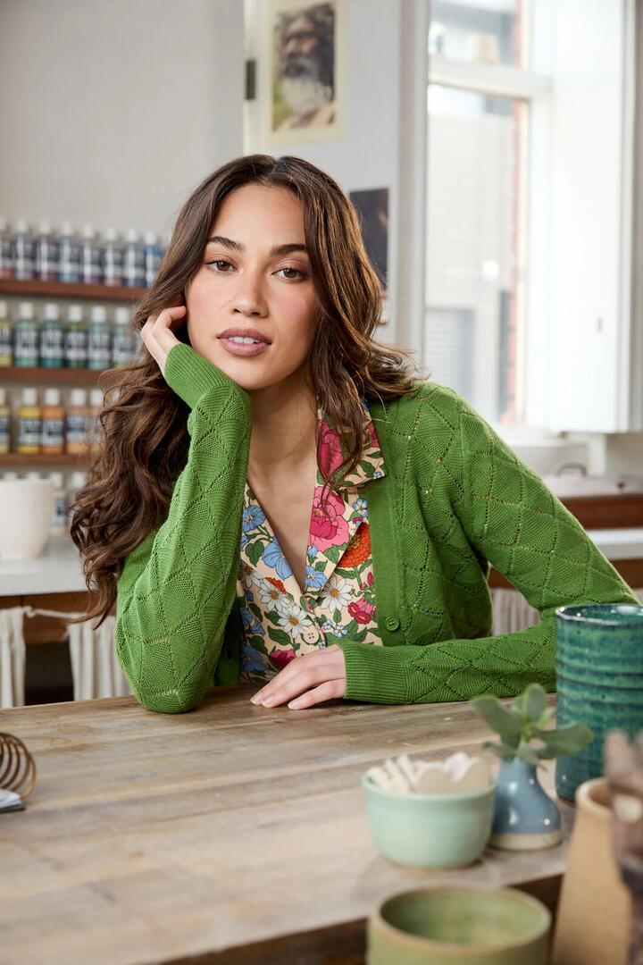 Image of a model wearing Outerwear. Productname: Celeste Cardi in Green colour by brand - Princess Highway