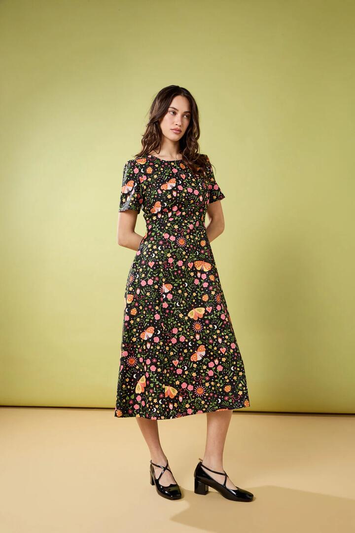 Image of a model wearing Dress. Productname: Folk Art Midi Dress in Pink colour by brand - Princess Highway
