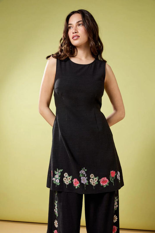 Image of a model wearing Dress. Productname: Fleur Embroidered Shift Dress in Black colour by brand - Princess Highway