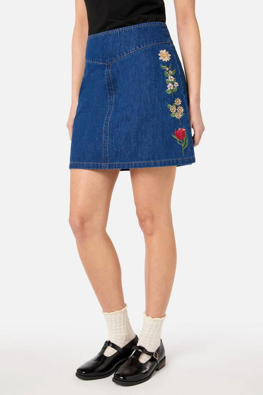 Image of a model wearing Denim. Productname: Fleur Embroidered Denim Skirt in Blue Denim colour by brand - Princess Highway
