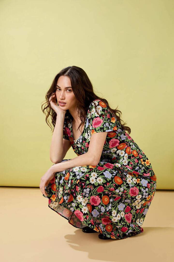 Image of a model wearing Dress. Productname: Floral Field Midi Dress in Black colour by brand - Princess Highway