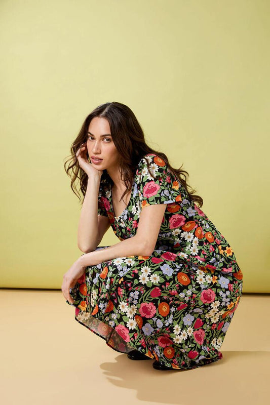 Image of a model wearing Dress. Productname: Floral Field Midi Dress in Black colour by brand - Princess Highway