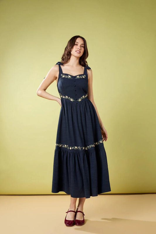 Image of a model wearing Dress. Productname: Esme Embroidered Midi Dress in Navy colour by brand - Princess Highway
