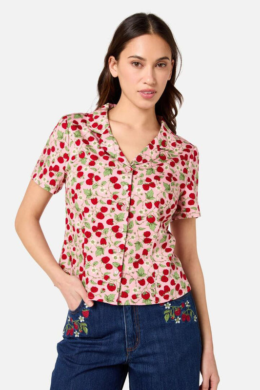 Image of a model wearing Shorts. Productname: Raspberry Short Sleeve Blouse in Pink colour by brand - Princess Highway