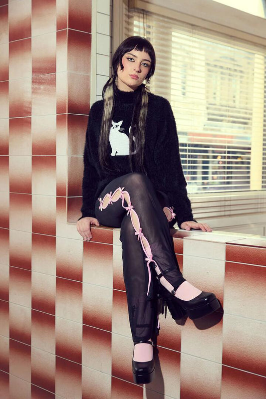 Image of a model wearing Pants. Productname: Forgotten City Mesh Cut Out Pant in Black colour by brand - Dangerfield