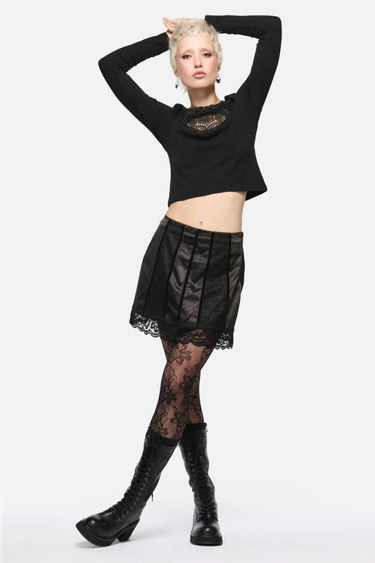 Image of a model wearing Skirts. Productname: Forgotten City Lace Trim Skort in Black colour by brand - Dangerfield