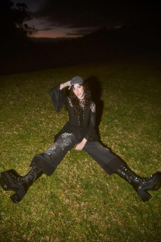 Image of a model wearing Denim. Productname: Sigil Distressed Wide Leg Jean in Black colour by brand - Black Friday