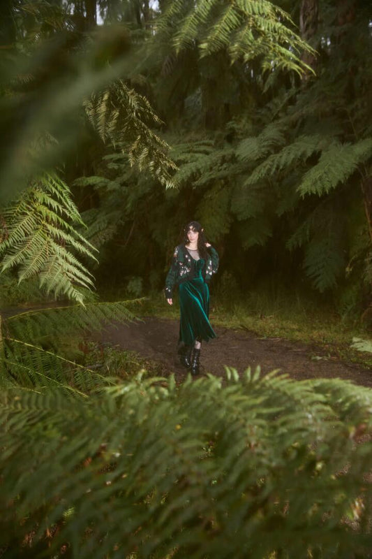 Image of a model wearing Skirts. Productname: Keeper Of The Woods Velvet Skirt in Emerald colour by brand - Black Friday