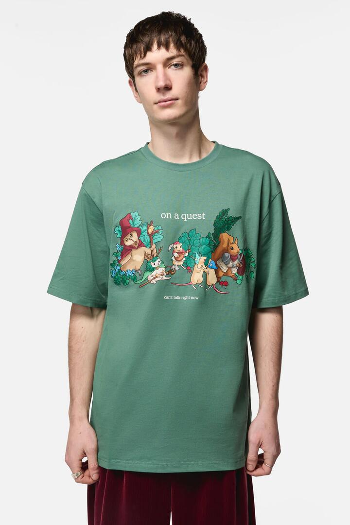 Image of a model wearing Tops. Productname: On A Quest Print Tee in Teal colour by brand - Black Friday