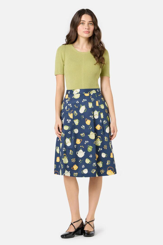 Image of a model wearing Skirts. Productname: Tea Time Pleat Skirt in Navy colour by brand - Princess Highway