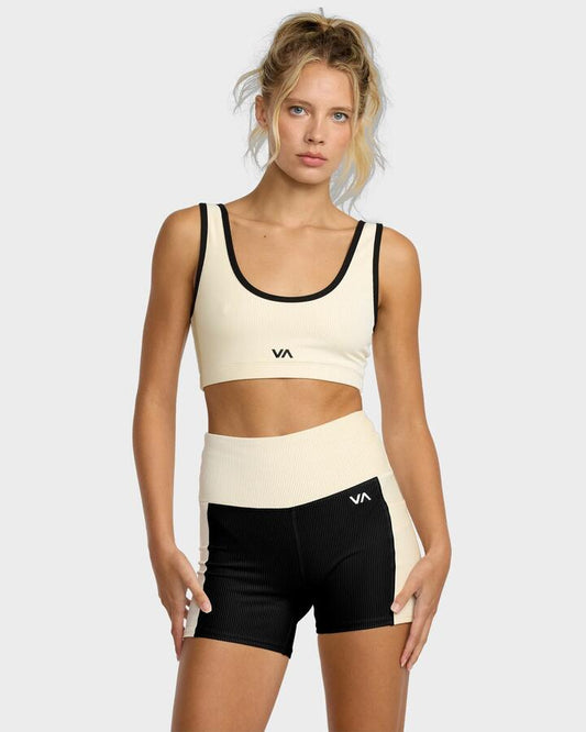 Image of a model wearing Shorts. Productname: RVCA Womens Essential Pocket Sport Shorts Vintage Khaki - in Vintage Khaki colour by brand - RVCA