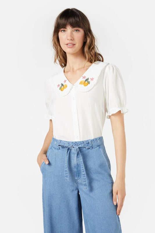 Image of a model wearing Tops. Productname: Lemonade Emb Blouse in Cream colour by brand - Princess Highway