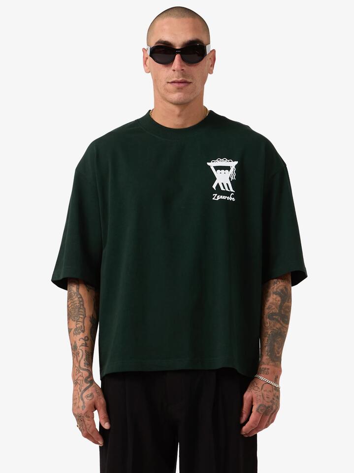 Image of a model wearing Tops. Productname: Zanerobe Pasta Kings Crop Flow Tee in Forest colour by brand - Zanerobe