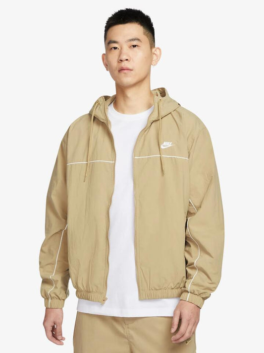 Image of a model wearing Outerwear. Productname: Nike Athlete Hooded Jacket in Parachute Beige colour by brand - Nike