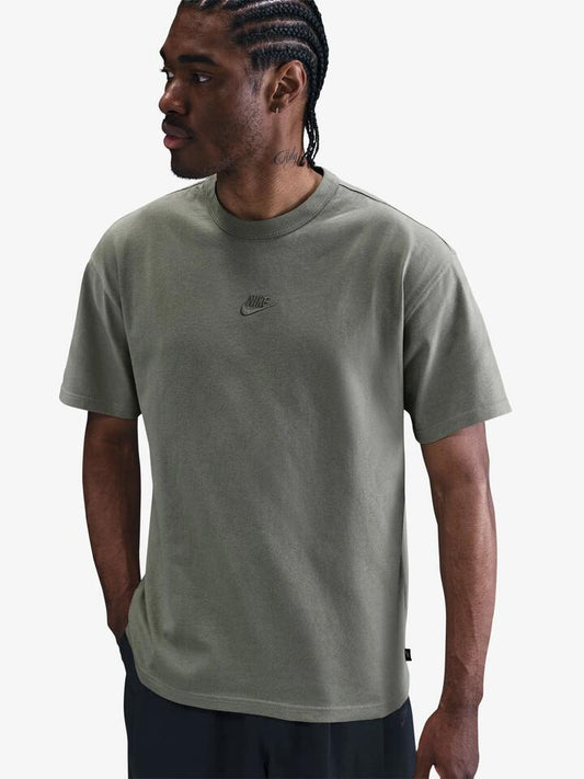 Image of a model wearing Tops. Productname: Nike Premium Essentials T-Shirt in Light Army colour by brand - Nike