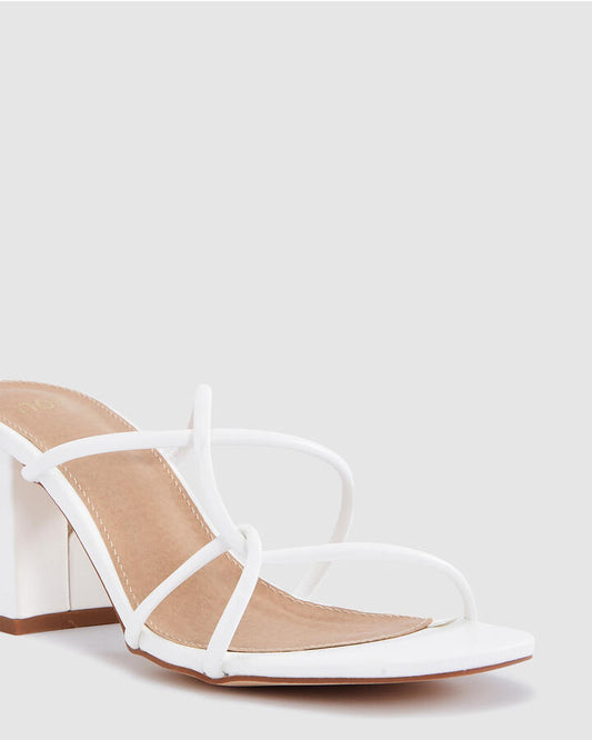 Image of Heels. Product name - Nia White Heels in Multi colour by brand - Novo
