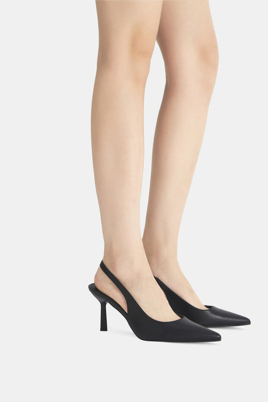 Image of a model wearing Skirts. Product name - Iraya Black Pumps in Black colour by brand - Novo