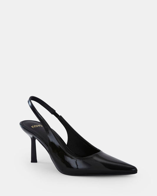 Image of a model wearing Skirts. Product name - Iraya Black Patent Pumps in Black colour by brand - Novo