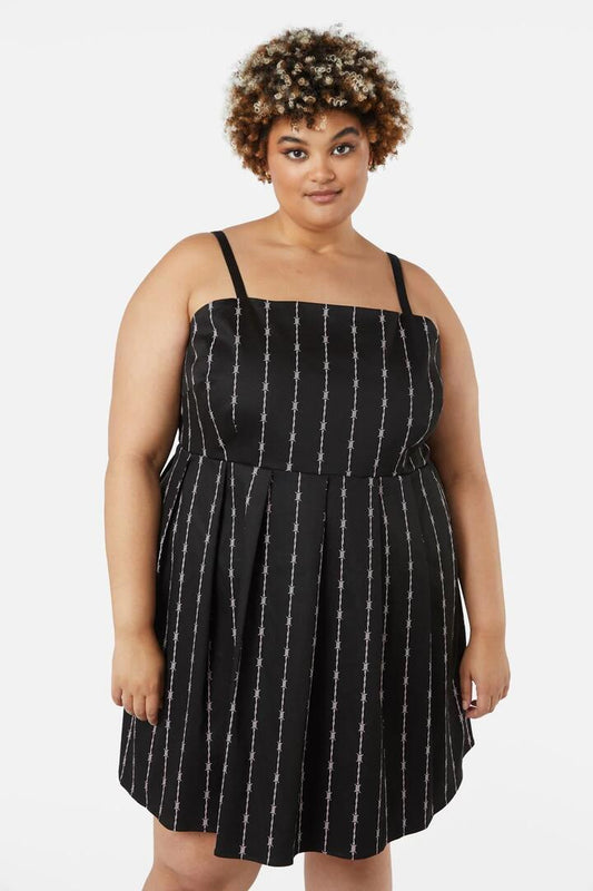 Image of a model wearing Dress. Productname: Curve Barbed Wire Bustier Pleated Dress in Black colour by brand - Dangerfield